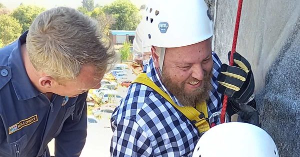 Quinton Boucher repels off a building with Newcastle K9 Search and Rescue Unit