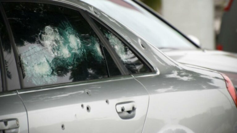 car bullet holes gunshots