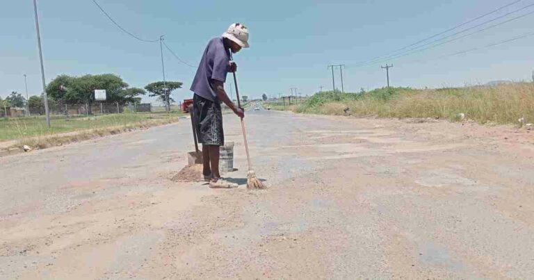Dedicated man works to repair the road to Madadeni Hospital 