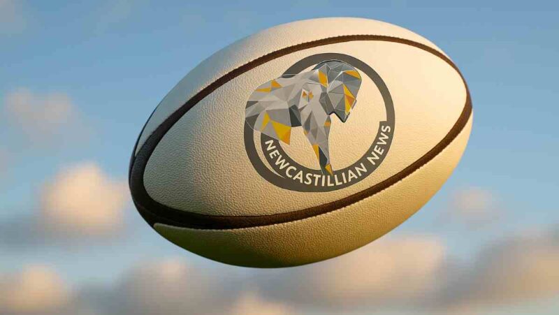 Weekend Rugby Results: Rugby ball with Newcastillian News logo, flying through the air